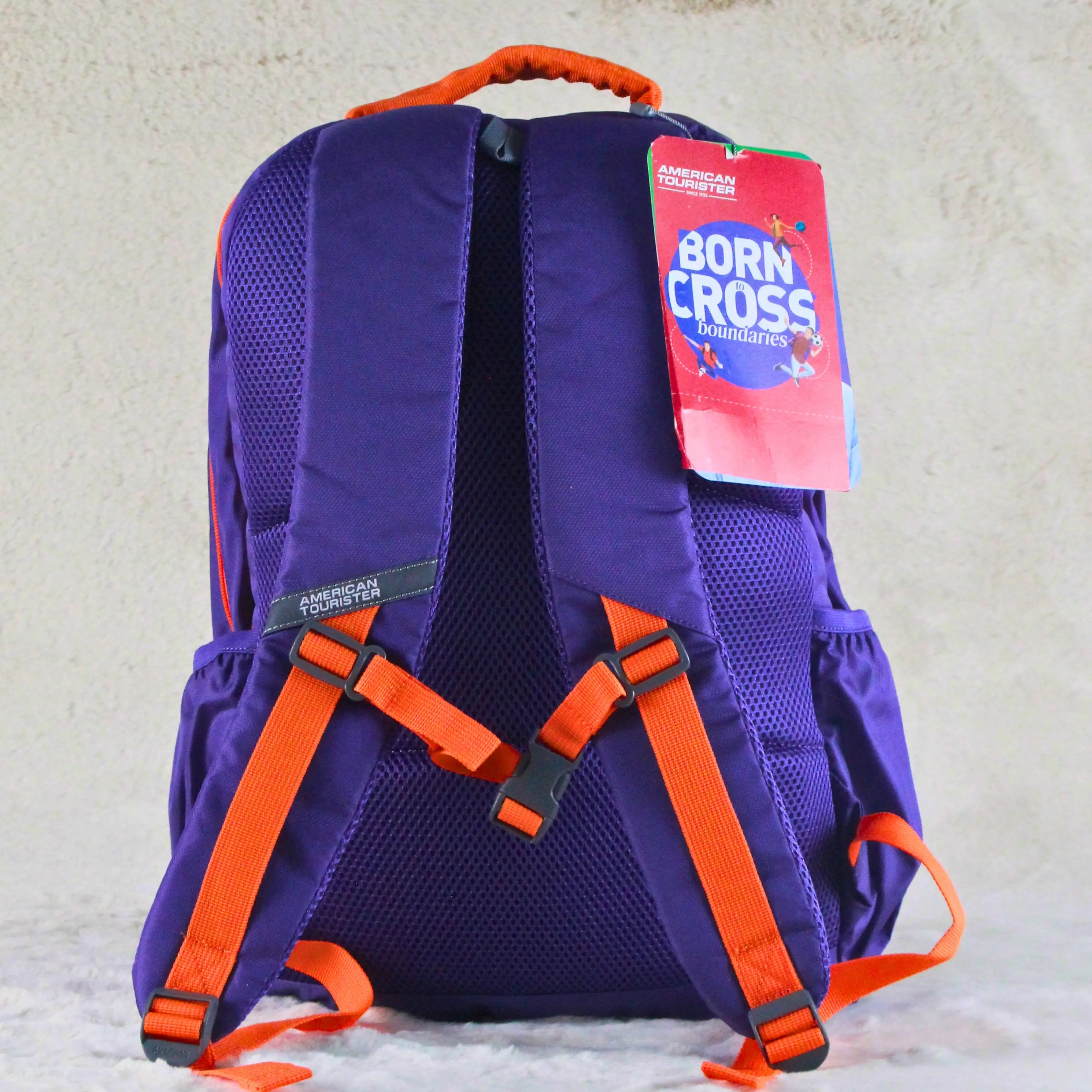 American Tourister Bold Purple & Orange Graphic Backpack – Spacious, Stylish & Travel Friendly – Imported